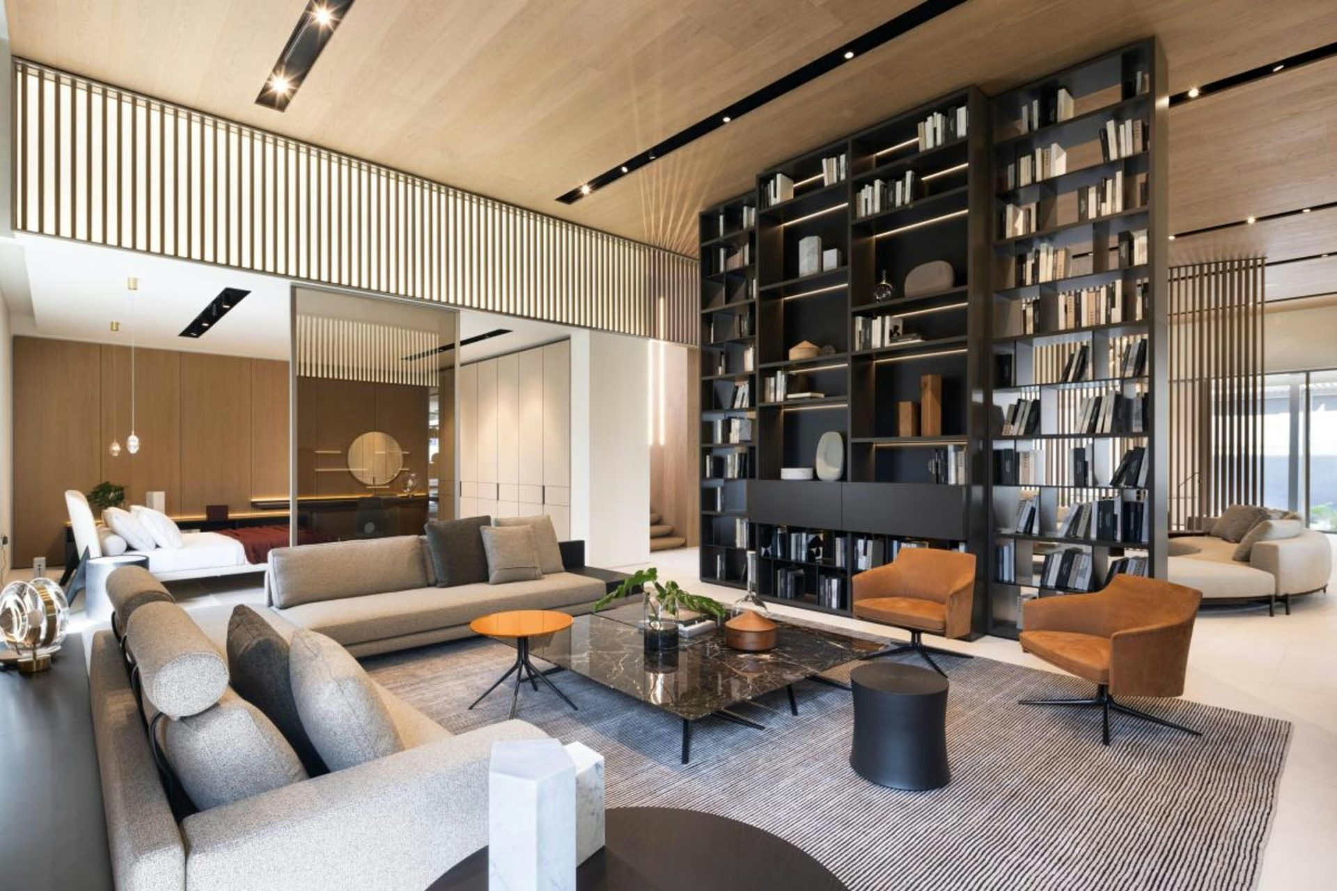 Charcoal living room with sculptural round pendant lighting and dark accent wall, luxury interior design Lucknow