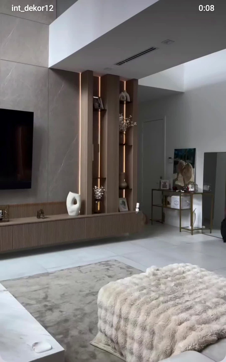 Real completed living room with wood slat pillars and boucle ottoman, Innovative Dekor Lucknow project